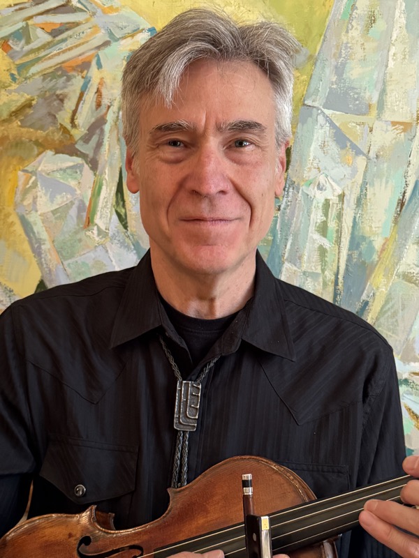 Craig Fry holding his violin